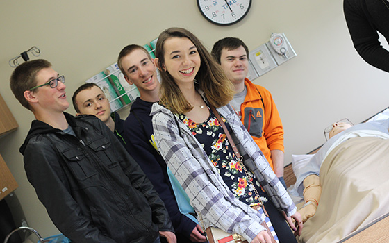 High school students visit the health lab simulators