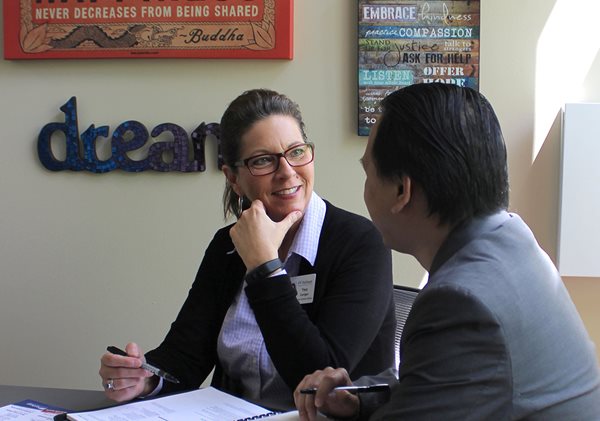 A student works with a career advisor on their resume