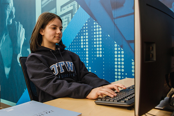 Young student works on homework at a desk