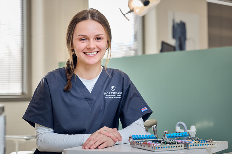 Dental hygiene student smiles at camera