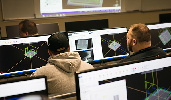 Students work on software in a computer lab