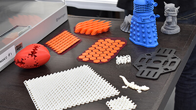 Array of 3D printed items on table
